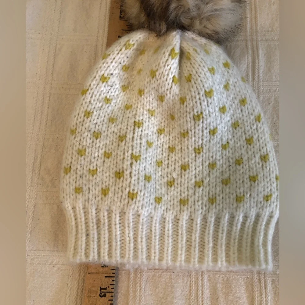 eerie off white and yellow beanie with pompom one size fits most